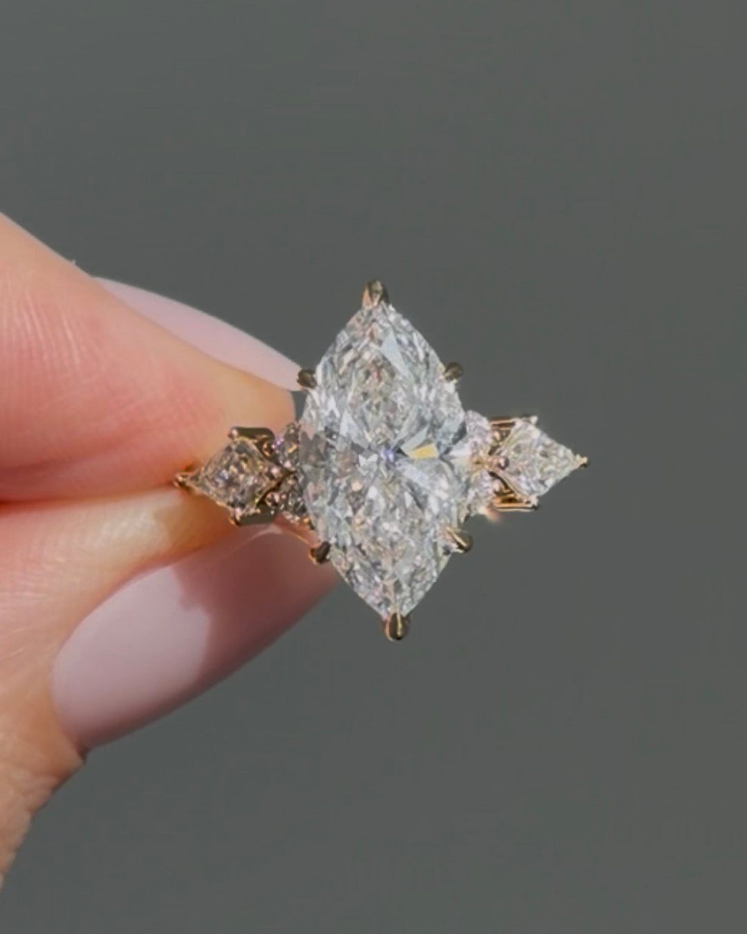 Marquise diamond ring with kite side stones